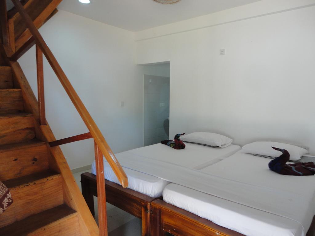 Yoho Hotel Arugambay Beach Inn อารูกัมเบย์ ห้อง รูปภาพ